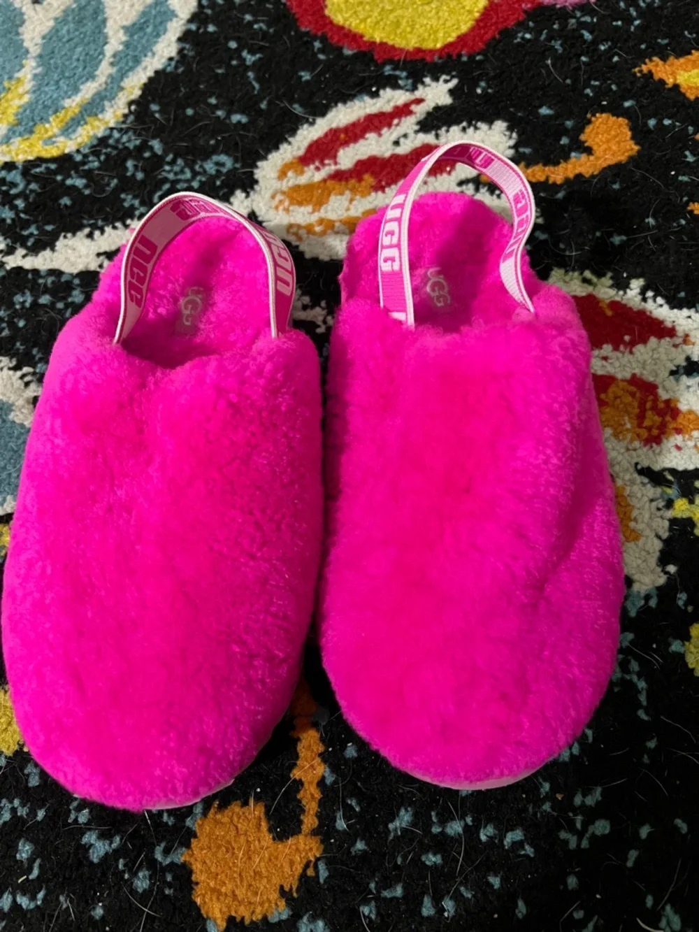 Pink fuzzy Ugg kids slip on
